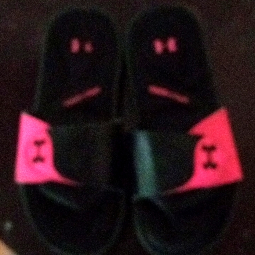 Woman's Pink and Black Under Armour Slides Size 6.